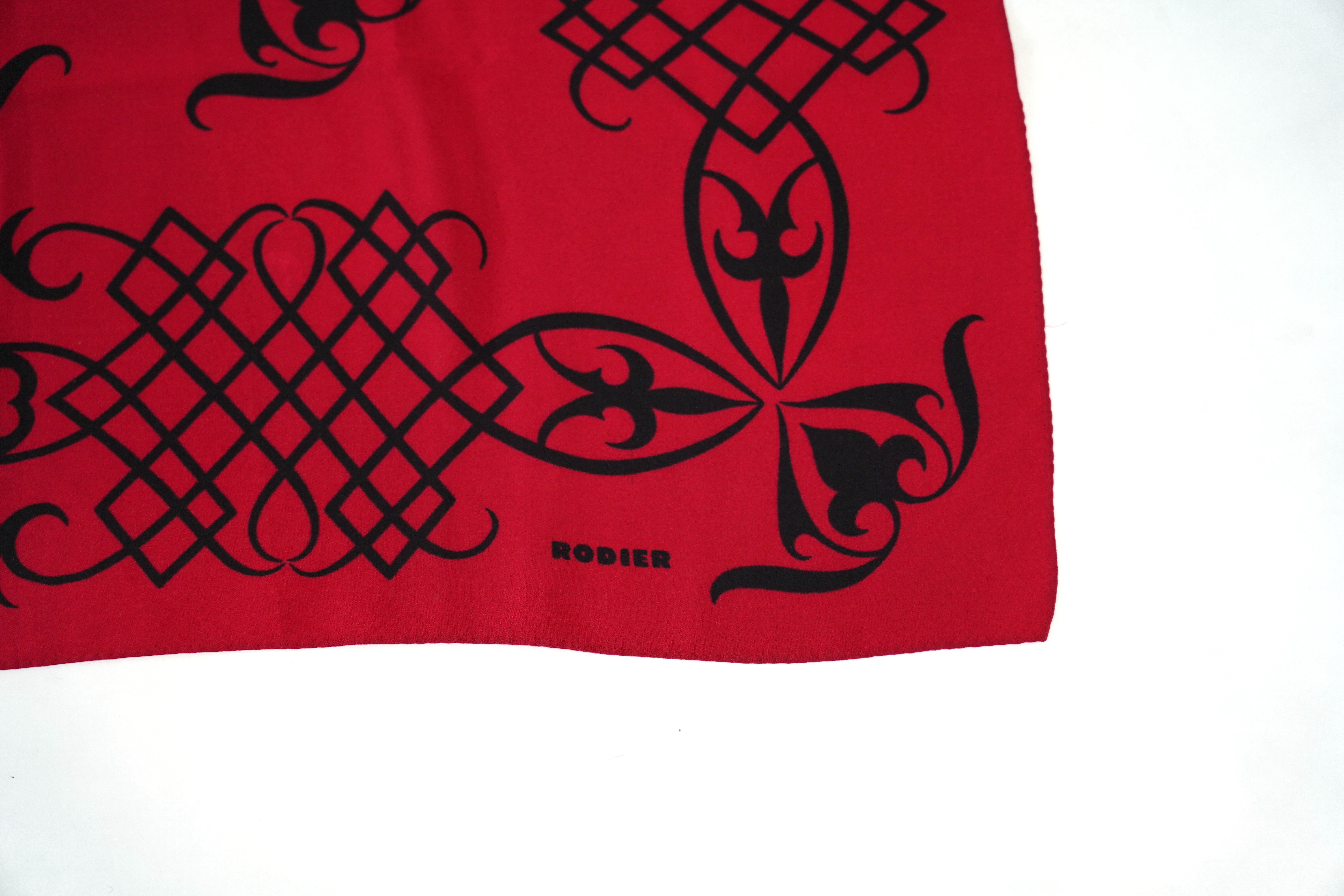 A Yves Saint Laurent silk scarf, a Jean Cocteau zodiac design silk scarf and a Rodier silk scarf.